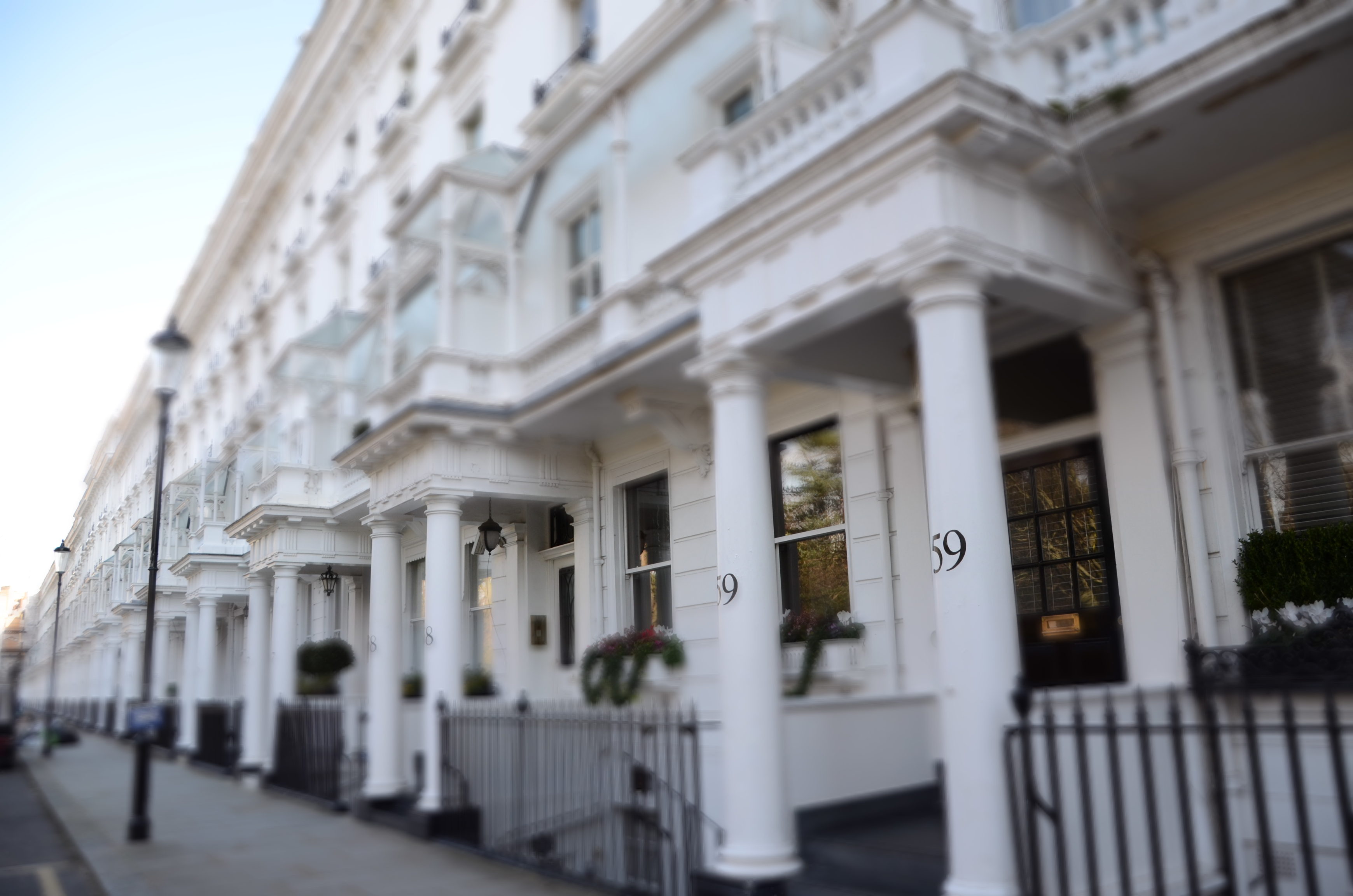 A long street of white domestic houses in London