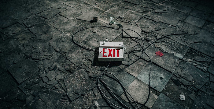 Old exit sign on floor