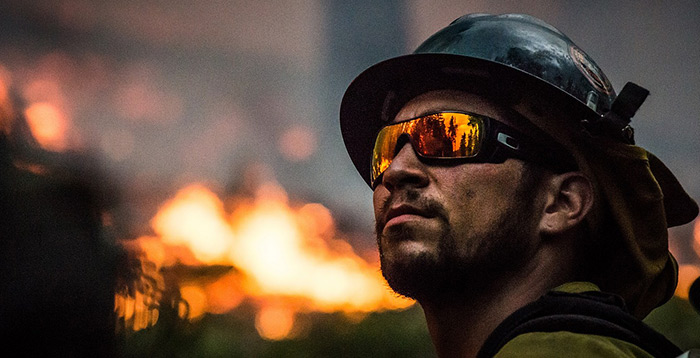 Firefighter looking at fire