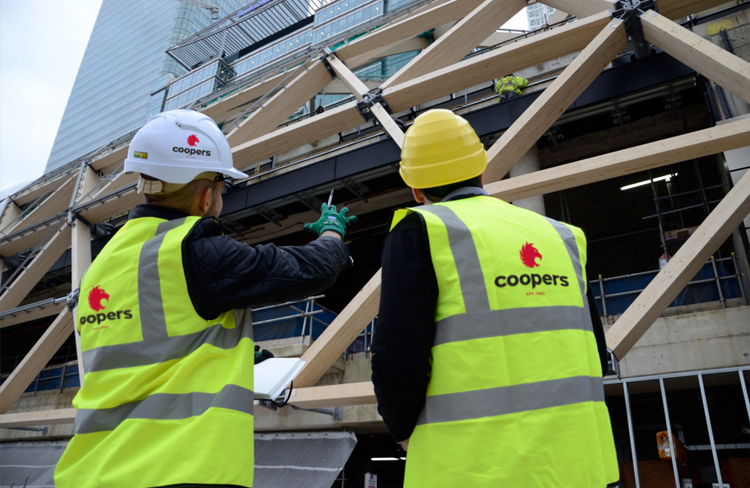 Coopers Fire contractors in high vis jackets on site