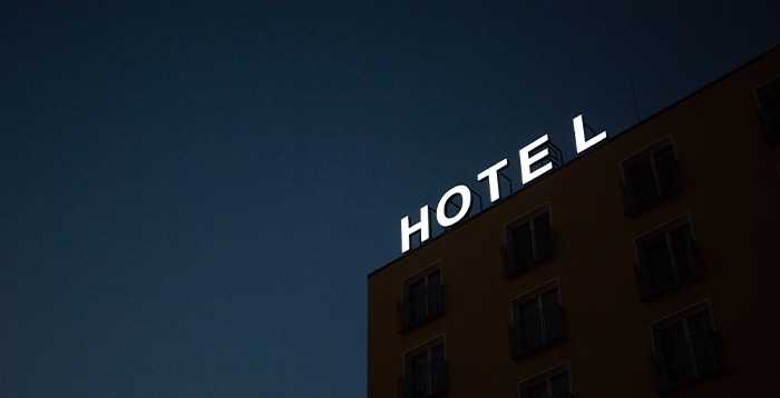 Hotel sign lit at night